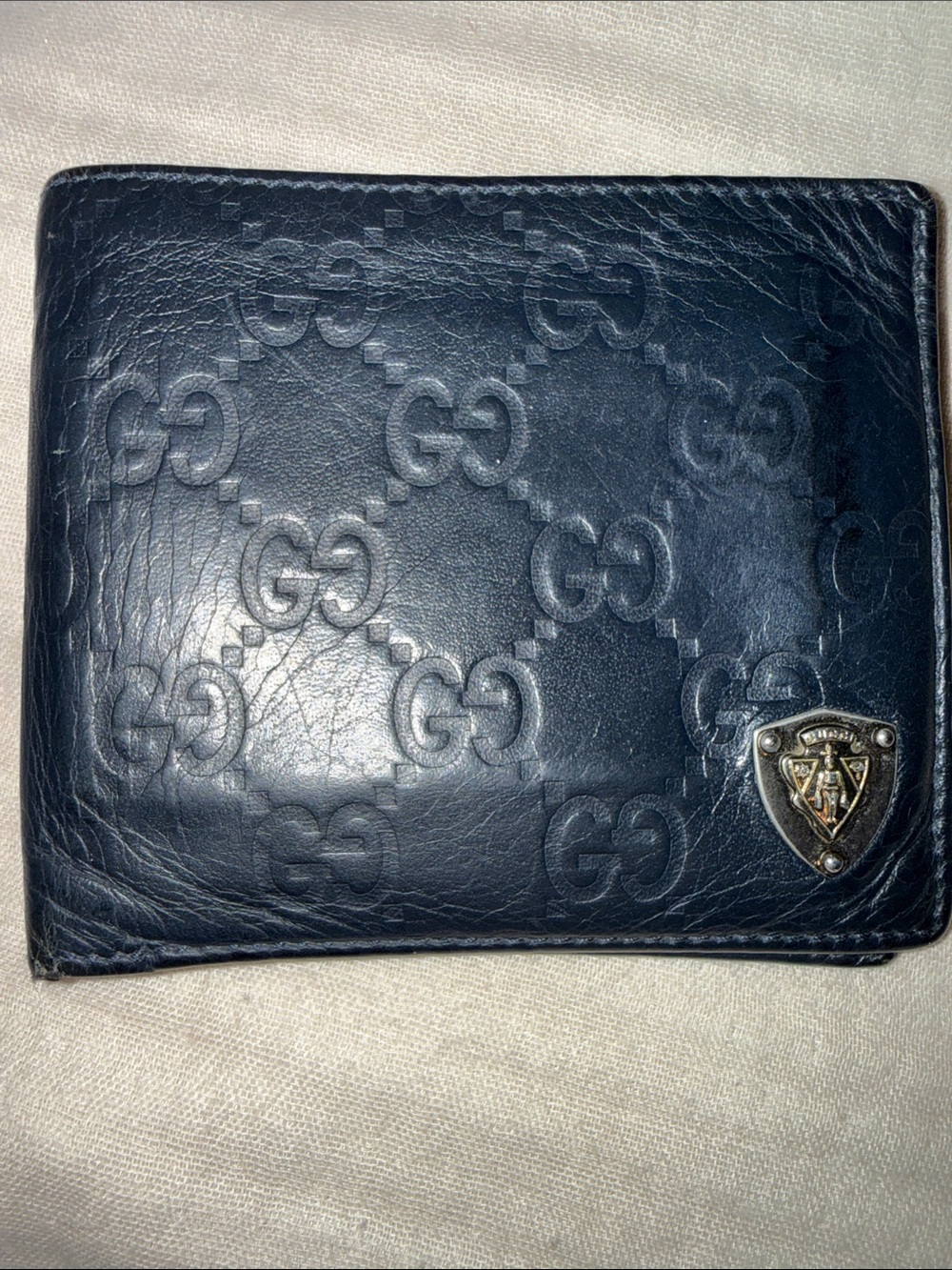 Gucci Black Embossed GG Leather Wallet with Metal Crest